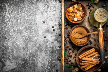 Coffee background. Welded coffee in a Turkish with sugar, cinnamon and coffee beans.