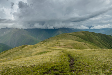 Great thunderstorm is comming. Summer in the big mountains.  Scenic view on Georgian Caucasus mountains.