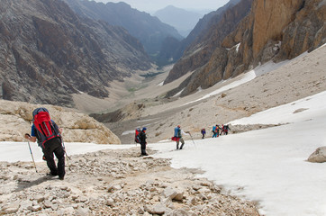 A group of mountaineers descending from the mountain pass. Turkey, Central Taurus Mountains,...