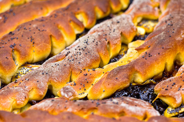 baked homemade rustic pie with apples, poppy seeds and jam