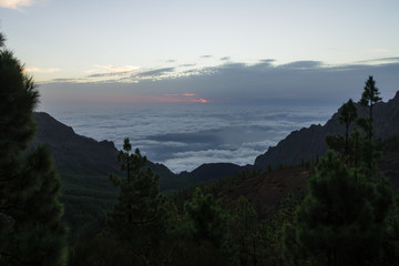 Cloud inversion in mountains during dawn before sunrise