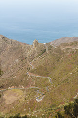 Remote road on through the hills next to the ocean