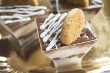 miniature pastry with melted chocolate and cream