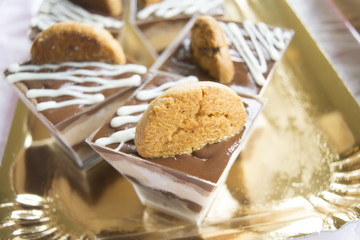 miniature pastry with melted chocolate and cream