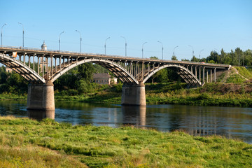 Fototapeta na wymiar The view at the bridge across the Volga river in the town of Staritsa, Russia