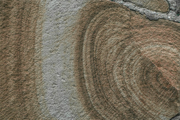 Texture from the picture obtained on a cut stone used for masonry in the construction of a stone house.
