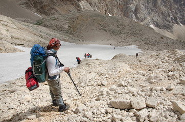 A group of mountaineers descending from the mountain pass. Turkey, Central Taurus Mountains,...