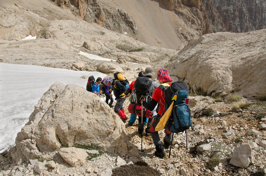 A group of mountaineers descending from the mountain pass. Turkey, Central Taurus Mountains, Aladaglar (Anti Taurus).