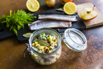Chopped ingredients for preparing herring salad.