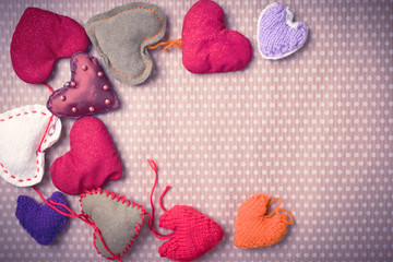 Valentine's Day. Colorful knitted hearts. Valentines day. Heart pendant. Vintage background in...