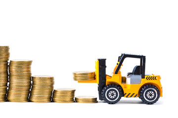 Mini forklift truck loading stack coin with steps of gold coin, isolated on white background with copy space, business finance and banking industrial concept.