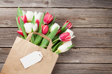 Colorful tulips in paper bag