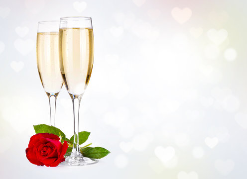 Two champagne glasses and rose