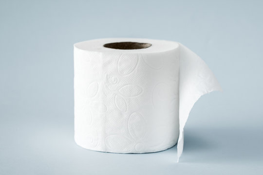 White roll toilet paper on the  light blue background