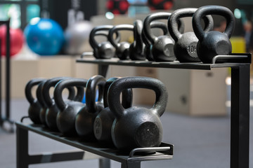 Group of Black Dumbbells in Gym: Weight Fitness Equipment
