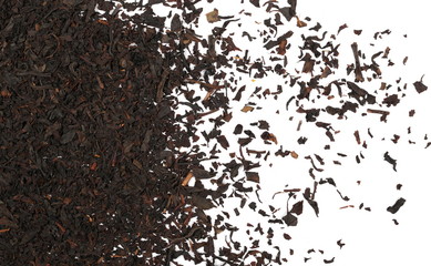 Fototapeta premium Dry black tea leaves isolated on white background, top view