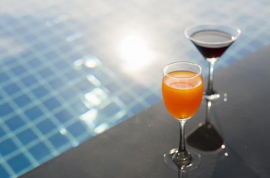 cocktail on the pool nosing at the tropical resort with copy space