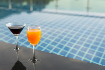 cocktail on the pool nosing at the tropical resort with copy space
