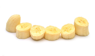 Beautiful peeled banana without peel cut into slices isolated on white background. Pieces, tropical fruit. Cutting. Flat lay, top view