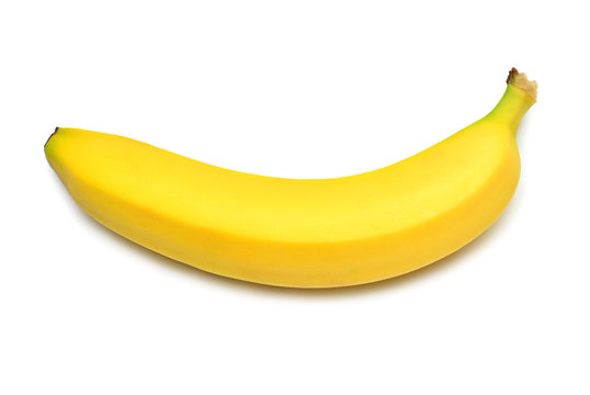 Single banana against white background. Isolated. Flat lay, top view. Yellow Fruit