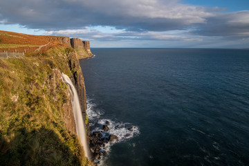 Fototapeta na wymiar Kilt Rock and Mealt Falls, Picturesque observation point offering panoramic views of waterfalls, cliffs & sea in Isle of Skye, Scottish Highlands