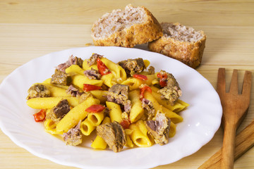 plate of macaroni and meat with tomato