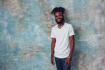 African American man with dreadlocks and a white T-shirt. Mock-up.