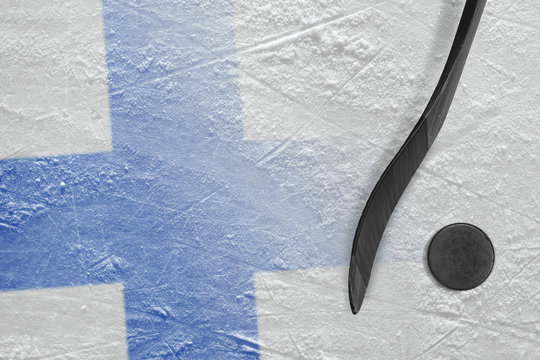 Image of the Finnish flag and hockey stick with a washer