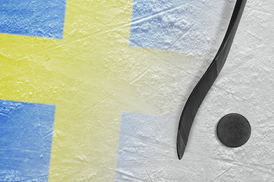 Image of a Swedish flag and a hockey stick with a puck