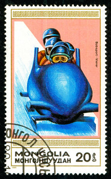 Ukraine - circa 2018: A postage stamp printed in Mongolia shows drawing Bobsleigh. Series: Winter sports. Circa 1989.