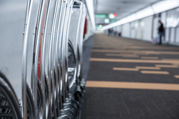 Luggage carts row on walk way in airport