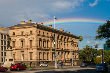 A rainbow behind the Parliament House of Victoria, Melbourne, Australia.