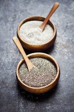 Wooden bowls of black and white chia seeds