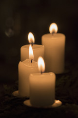 Fototapeta na wymiar Four candles in detail