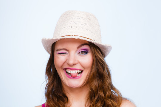 Woman in summer straw hat on head smiling