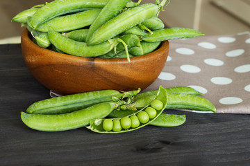 Green peas on the kitchen table.