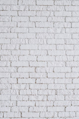 Textured white brick wall. Vertical. Clear space