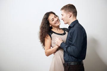 romantic couple posing on white background, love concept