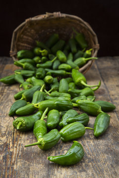 Pimientos de Padron on dark wood