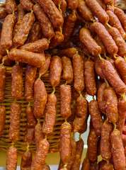 Smoked sausages are put up for sale on the market.