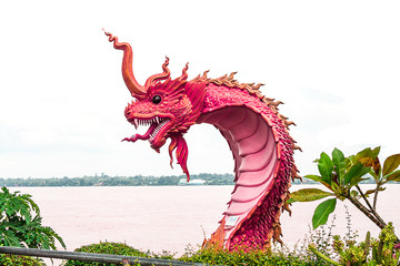 naga statue at river side in public park between Thailand and la