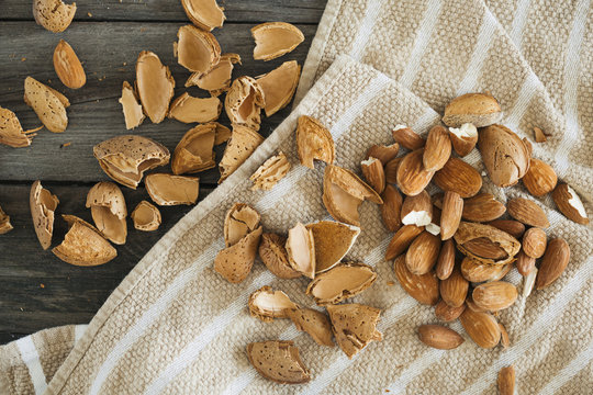 Cracked almonds on kitchen towel