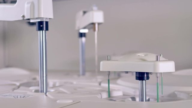 A working hematology analyzer with moving parts. 