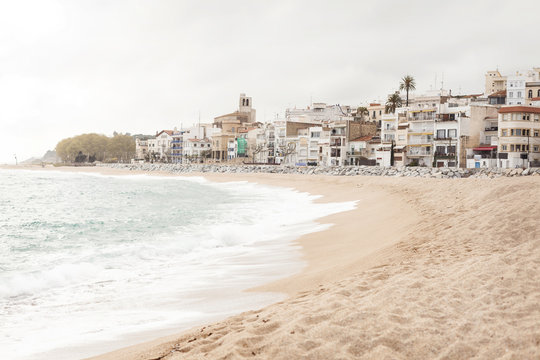 Spain, Sant Pol de Mar, view to empty beach