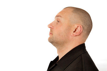 Portrait of the young unshaven man in profile