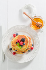 American pancakes with blueberries, raspberries and mint
