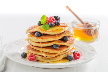 American pancakes for breakfast in the morning on white background