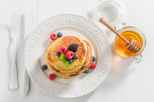Top view of american pancakes with berries