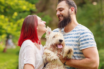 Laughing couple with dog