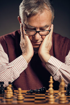 Portrait of senior man who capitulated in chess game.